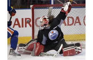 Greg Southam, Edmonton Journal Szabados makes a save during the Oilers practice on March 5, 2014.
